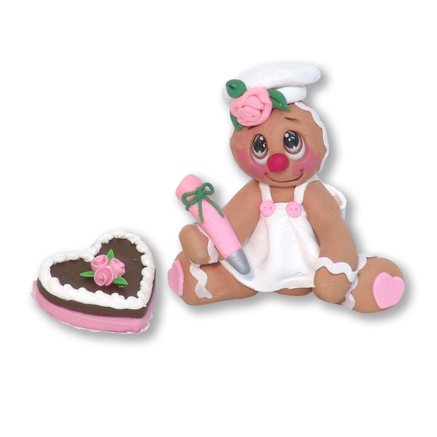 Valentine Gingy Decorating a Heart Cake