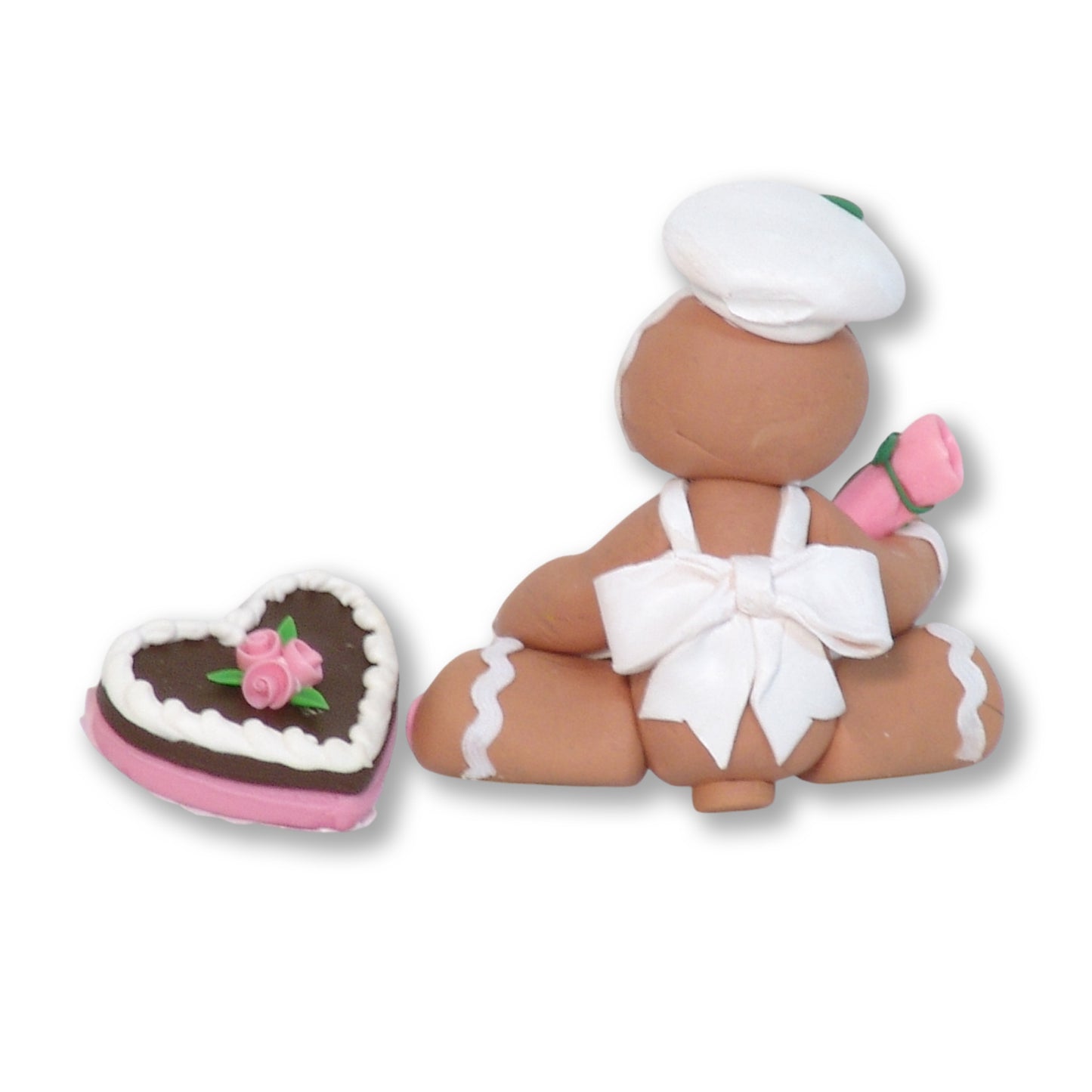 Valentine Gingy Decorating a Heart Cake