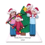 Family of 4 Putting Lights on Tree